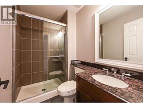 Vancouver apartment for rent - A bathroom with a toilet, sink, and shower.