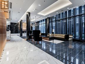 Toronto (Mount Pleasant East) condo for rent - A spacious lobby with a marble floor and a large window.