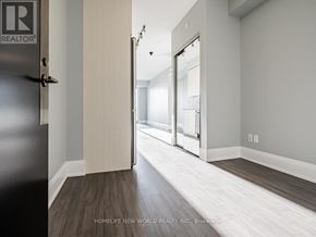 Toronto (Mount Pleasant East) condo for rent - A hallway with a black door on the left and a glass door on the right.