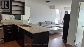 Toronto (Kensington-Chinatown) condo for rent - A kitchen with a sink and a counter top.