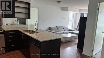 Toronto (Kensington-Chinatown) condo for rent - A kitchen with a sink and a counter top.