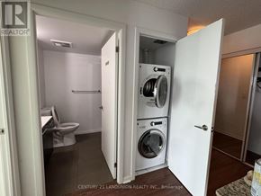 Toronto (Kensington-Chinatown) condo for rent - A laundry room with a washer and dryer in it.