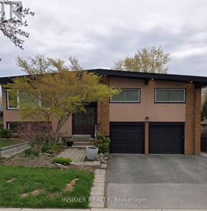 Hamilton (Buchanan) apartment for rent - A house with a brown garage door is for sale.