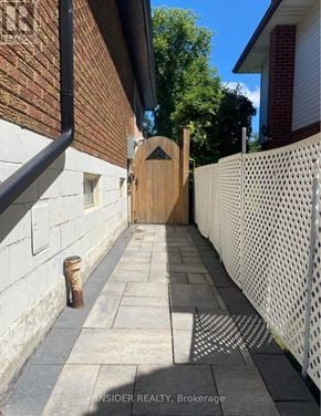 Hamilton (Buchanan) apartment for rent - A white fence with a wooden gate in the middle.