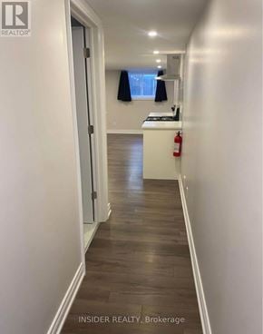 Hamilton (Buchanan) apartment for rent - A long hallway with a fire extinguisher on the right.
