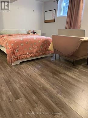 Toronto (Newtonbrook West) apartment for rent - A bedroom with a bed and a chair.