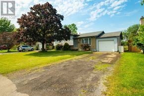 Port Colborne (Main Street) apartment for rent - A house with a driveway in front of it.