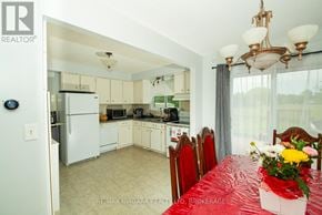 Port Colborne (Main Street) apartment for rent - A kitchen with a table set for a meal.