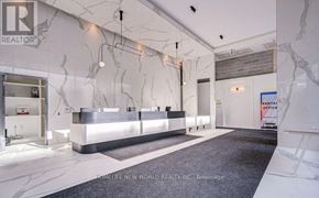 Toronto (Church-Yonge Corridor) condo for rent - A realtor's office with a marble wall and a reception desk.