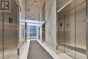 Toronto (Church-Yonge Corridor) condo for rent - A hallway with elevators and a sign that says REALTOR.