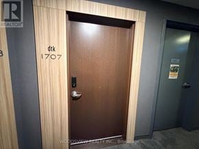 Kitchener condo for rent - A brown door with the number 1707 on it.