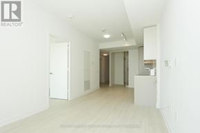 Mississauga (City Centre) condo for rent - A white room with a door and a counter.