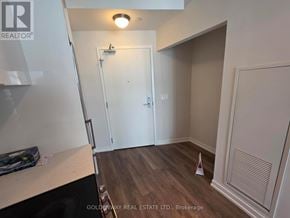Toronto (Niagara) condo for rent - A room with a white door and a wooden floor.