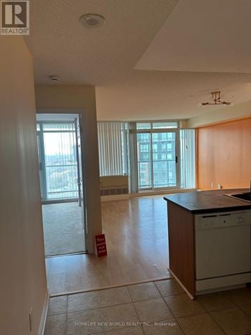 Toronto (Willowdale West) condo for rent - A kitchen with a dishwasher and a washing machine.