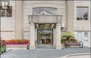 Toronto (Willowdale West) condo for rent - A building entrance with a glass door and a bench in front.