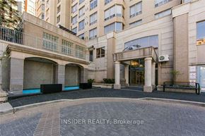 Toronto (Willowdale West) condo for rent - A building entrance with a sign that reads "INSIDER REALTY: Brokerage".