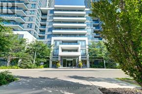 Markham (Grandview) condo for rent - A modern multi-story residential building with a driveway in front.