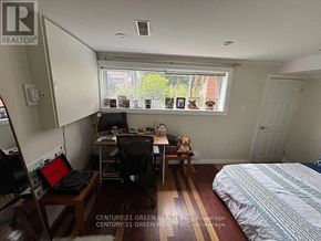 Toronto (Alderwood) apartment for rent - A bedroom with a bed, desk, and chair.