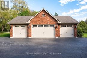 Burlington apartment for rent - A two-car garage with a brick facade and a pitched roof.