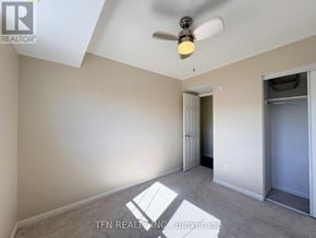 Mississauga (Cooksville) townhouse for rent - A room with a ceiling fan and a light fixture.
