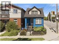Hamilton (Homeside) apartment for rent - A blue house with a white window and a brown roof.