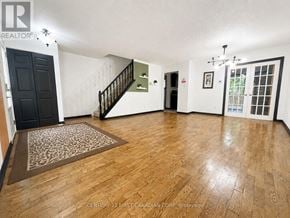 London North (North I) apartment for rent - A room with wooden flooring and a staircase.