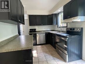 London North (North I) apartment for rent - A kitchen with black cabinets and stainless steel appliances.