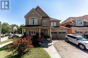 Pickering (Brock Ridge) apartment for rent - A large house with a car parked in front.
