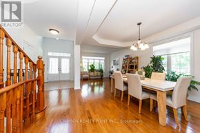 Pickering (Brock Ridge) apartment for rent - A dining room with a wooden table and chairs.
