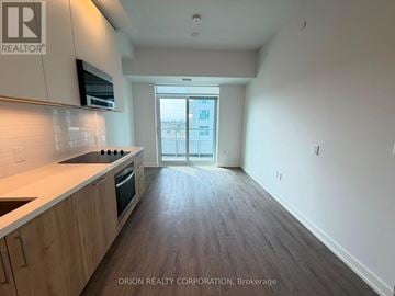 Vaughan (Vaughan Corporate Centre) condo for rent - A kitchen with a counter top and a stove top oven.