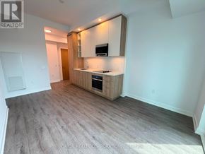 Vaughan (Vaughan Corporate Centre) condo for rent - A kitchen area with a countertop and cabinets.