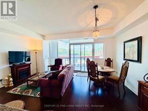 Mississauga (Port Credit) condo for rent - A living room with a couch, chairs, and a television.