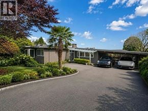 West Vancouver apartment for rent - A residential property with a driveway and two cars parked in front.
