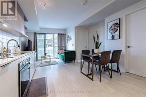 Toronto (Flemingdon Park) condo for rent - A modern kitchen with a dining table set for four.