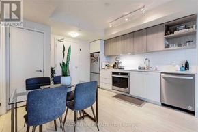 Toronto (Flemingdon Park) condo for rent - A modern kitchen with a dining table and chairs.