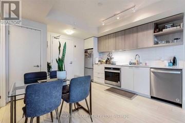 Toronto (Flemingdon Park) condo for rent - A modern kitchen with a dining table and chairs.