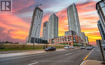 Mississauga (Creditview) condo for rent - A cityscape with skyscrapers and a sunset sky.