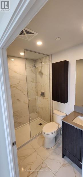 Mississauga (Creditview) condo for rent - A bathroom with a toilet, sink, and walk-in shower.