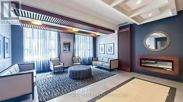 Hamilton (Central) condo for rent - A living room with a grey rug and a white sofa.