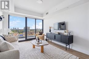 Toronto (Thorncliffe Park) condo for rent - A living room with a flat screen TV and a view of the city.