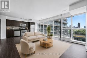 Toronto (Niagara) condo for rent - A living room with a couch, chair, and a coffee table.