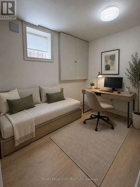 Whitby (Downtown Whitby) apartment for rent - A cozy bedroom with a bed, desk, and chair.