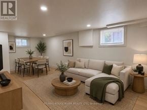 Whitby (Downtown Whitby) apartment for rent - A living room with a couch, coffee table, and a dining table.
