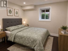 Milton (Sc Scott) apartment for rent - A bedroom with a bed, nightstand, and window.