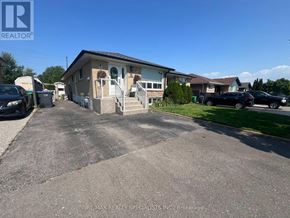 Mississauga (Clarkson) apartment for rent - A house with a driveway in front of it.