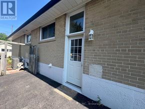 Mississauga (Clarkson) apartment for rent - A house with a white door and windows is for sale.