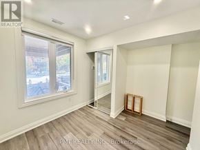 Toronto (Little Portugal) apartment for rent - A room with a window and a door leading to another room.