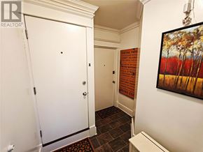 St. John's multi-family for rent - A hallway with a sign that says Central Park Conservatory Garden.