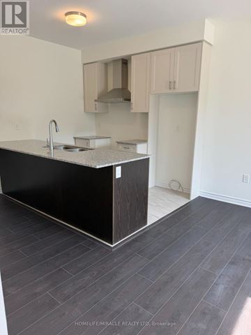 Brampton (Northwest Brampton) townhouse for rent - A kitchen with a sink and a counter.