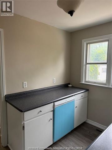 Windsor apartment for rent - A kitchen with a window and a counter top.